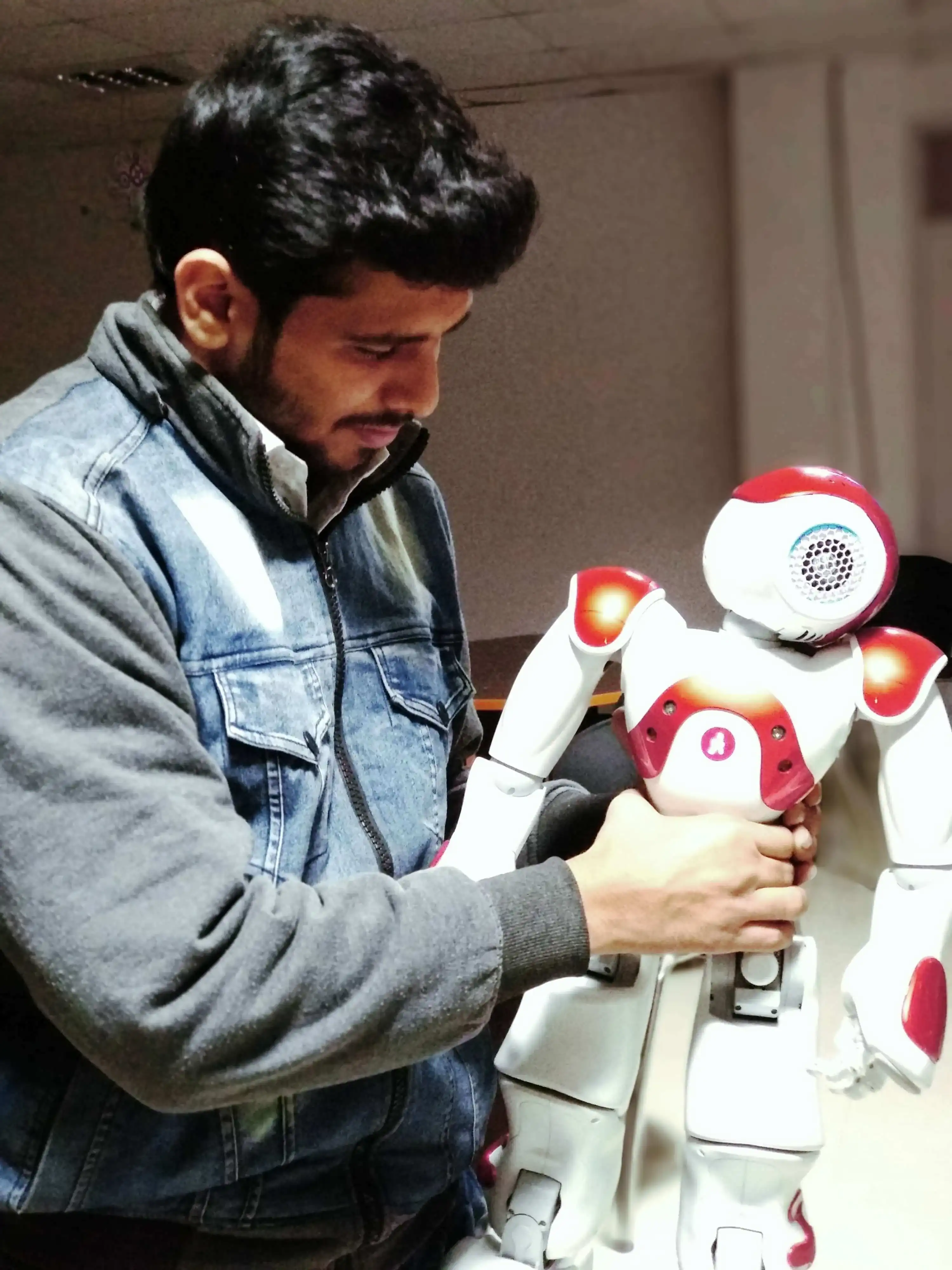 Ritwik Joshi, AI and Robotics expert, showcasing the NAO humanoid robot during a demonstration on physical AI.