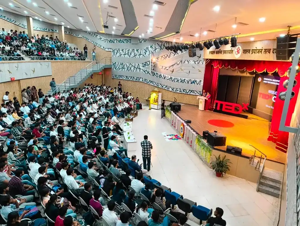Audience deeply engaged during Ritwik Joshi's TEDx presentation on physical AI and robotics.