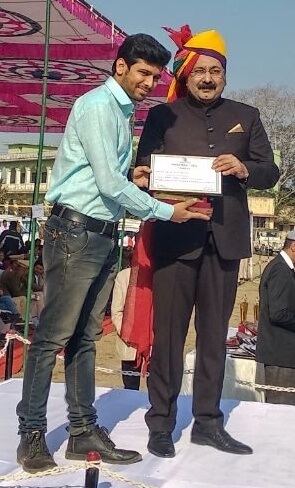 Ritwik Joshi receiving award from District Collector for Entrepreneurial Activities