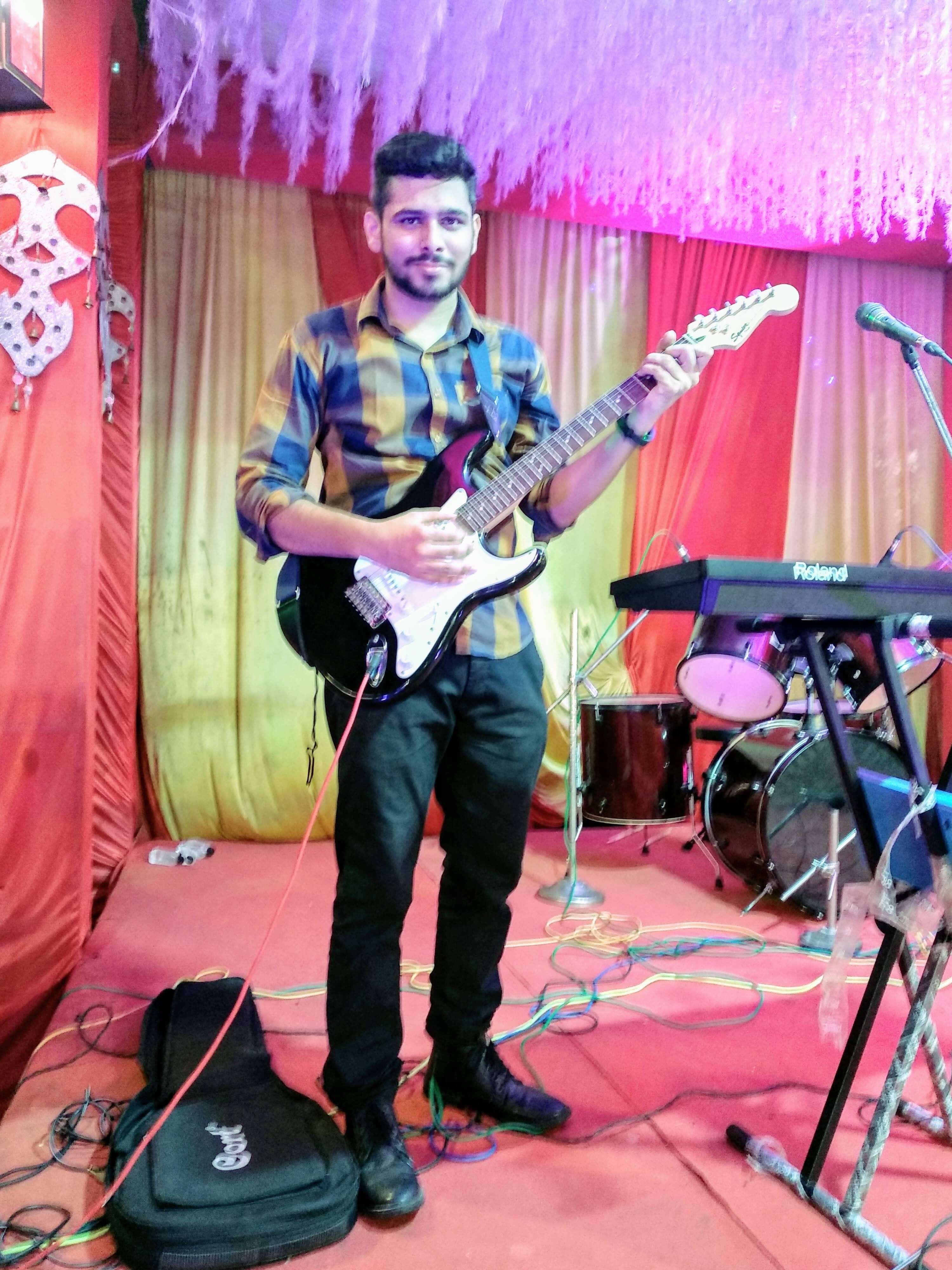 Ritwik Joshi performing with Electric Guitar