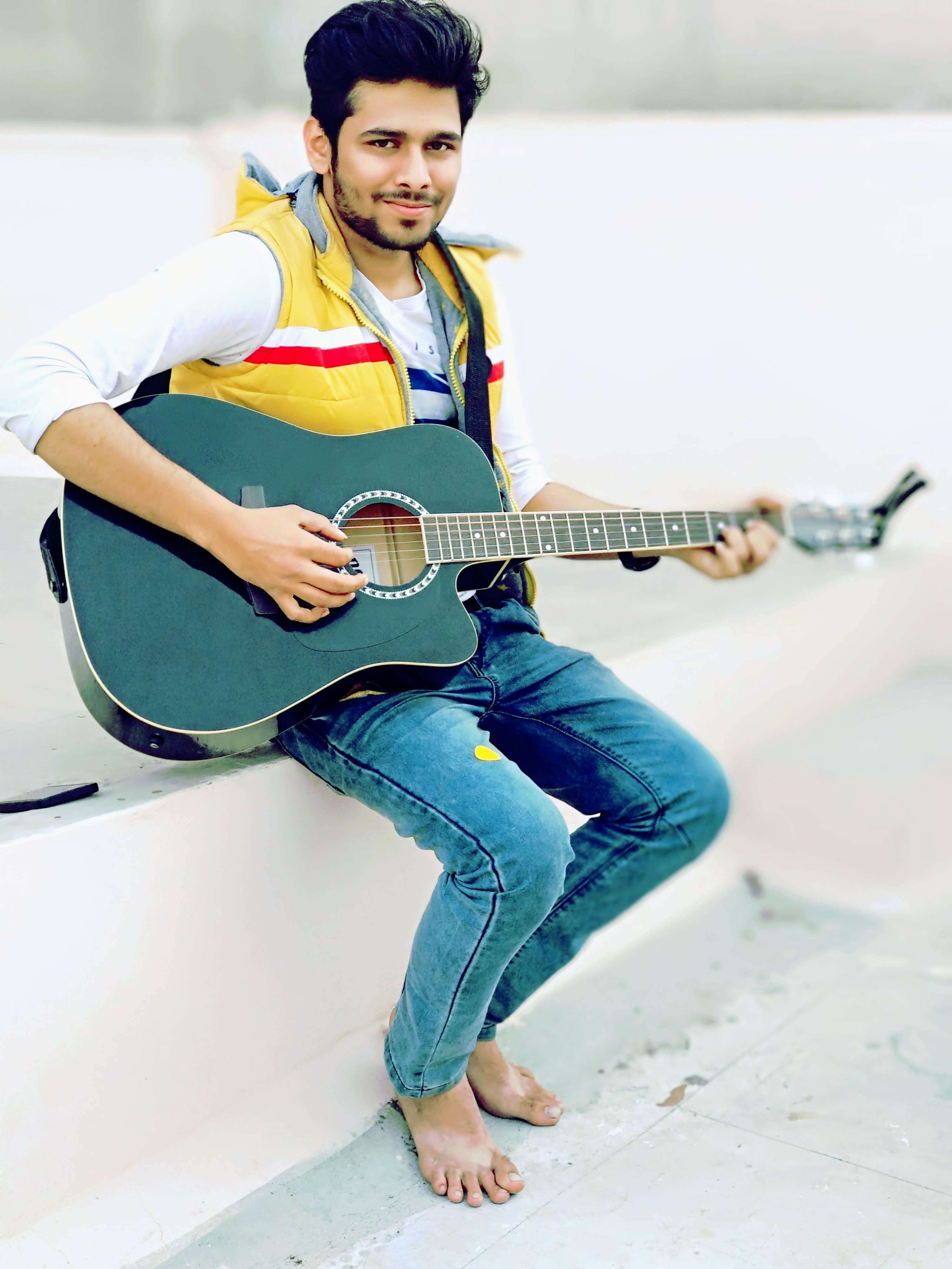 Ritwik playing guitar at rooftop