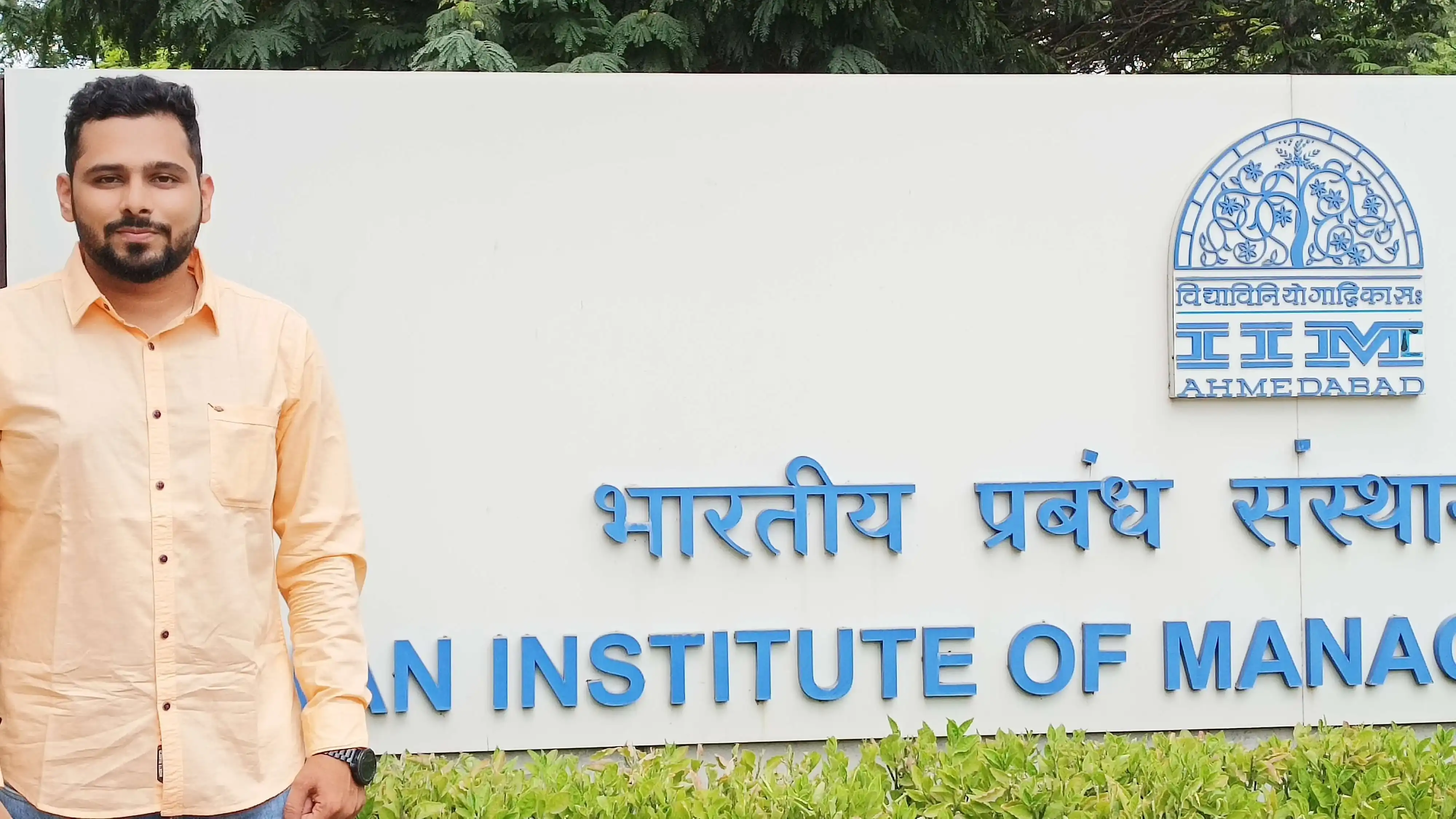Ritwik Joshi standing on the campus of the prestigious Indian Institute of Management Ahmedabad (IIMA).